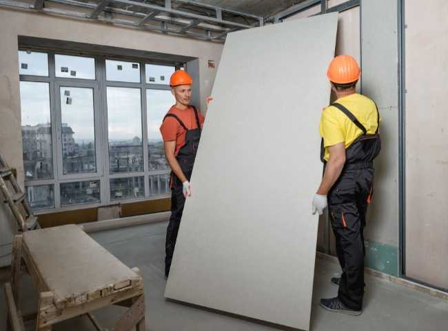 Drywall Contractor Installing Gypsum Board