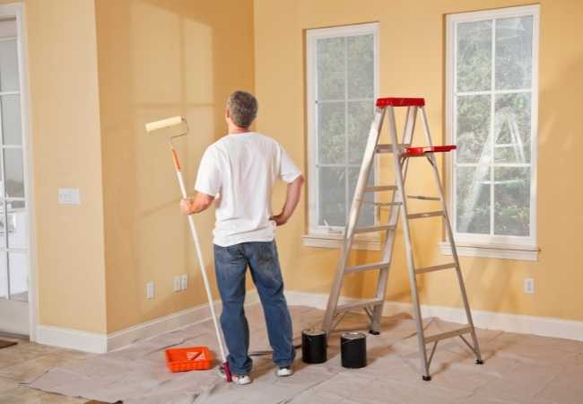 Professional Painter Working on Wall